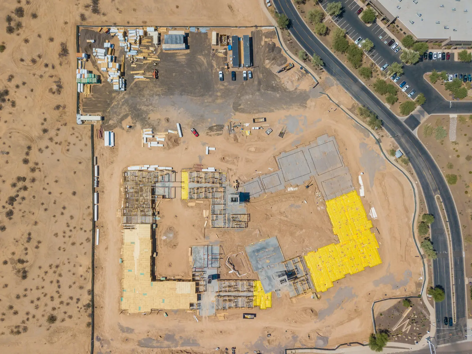 Self-storage development under construction at dusk with equipment on site